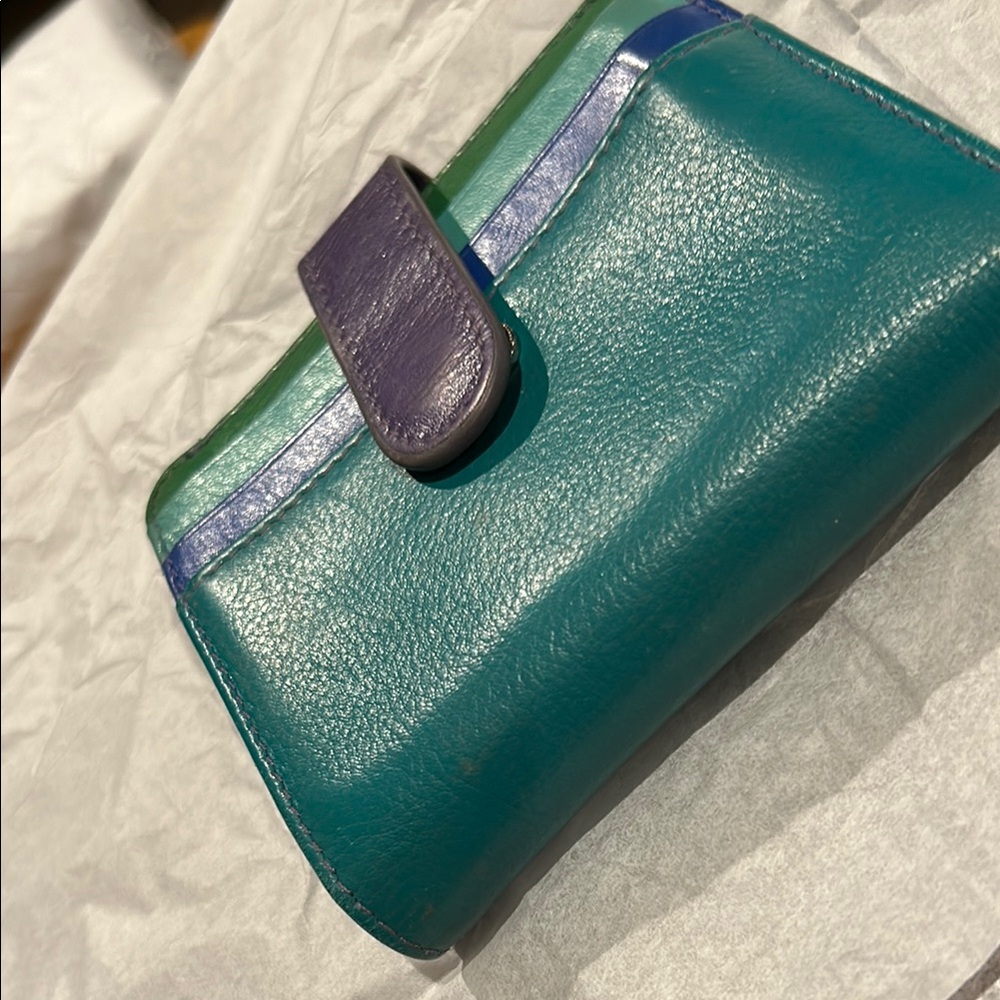 Teal Green Leather Wallet with Textured Surface and Stylish Closure